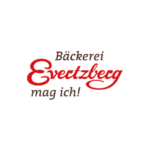Logo der Bäckerei Evetzberg mit roter Schrift und Slogan „mag ich!“